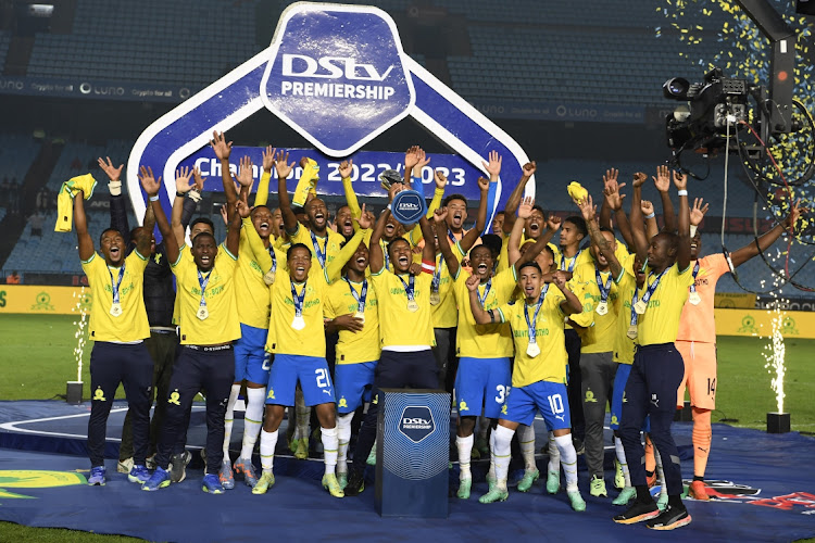 Mamelodi Sundowns captain Themba Zwane lifts the trophy with players celebrates winning DStv Premiership during the DStv Premiership match between Mamelodi Sundowns and Maritzburg United at Loftus Versfeld Stadium on May 16, 2023 in Pretoria, South Africa.