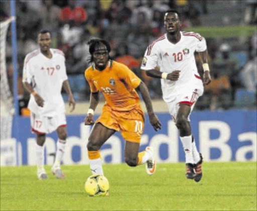 POACHER: Ivory Coast's Yao Kouassi Gervinho is chased by Sudan's Tahir Osman Mohamed during their Africa Cup of Nations match at Malabo Stadium in Malabo last Sunday. Photo: REUTERS