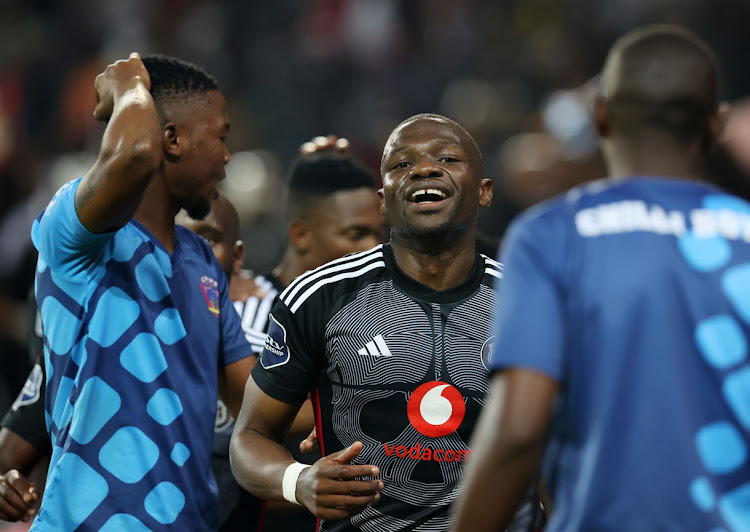 Tshegofatso Mabasa of Orlando Pirates celebrates one of his two goals with teammates in their DStv Premiership win against Chippa United at Orlando Stadium on Wednesday night.