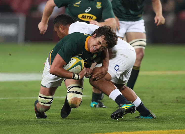 Franco Mostert of South Africa tackled by Mako Vunipola of England during the international rugby match between South Africa and England at Ellis Park, Johannesburg on June 9 2018.