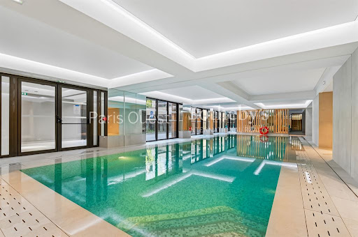 Property purchase in Neuilly-sur-Seine (92200) - Modern indoor swimming pool with green tiling