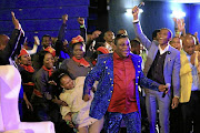 Timothy Omotoso (red shirt) among his congregants.