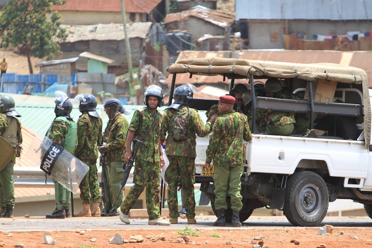 Police officers man a road in Kibera to prevent Azimo supporters from accessing the CBD, March 30, 2023.