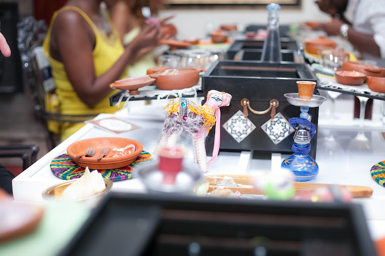 Shisha pipes and a treasure chest of delights decorate the table during the Moroccan course.