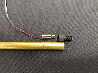 Cut a small piece of brass tube to attach the motor to the back of the trickler tube.