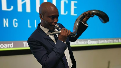 MultiChoice Group CEO, blowing the horn when the company listed on the JSE on 27 February.