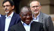 President Cyril  Ramaphosa waves after addressing the media on the stairs of the Union Buildings after engaged certain political parties and business leaders amid the outbreak of the coronavirus.
