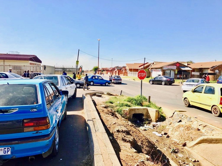 Private taxis queue at Pholosong hospital. Business has boomed for them since the Tsakane minibus taxi rank has been closed.