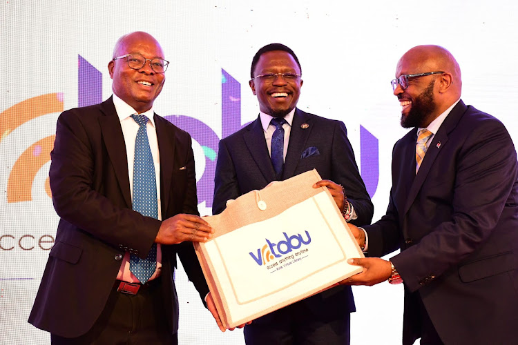 KNLS CEO Charles Nzivo, Ministry of Youths Affairs, Sports and Arts CS Ababu Namwamba and KNLS Board Chair, Bishop Robert Theuri Maina during the launch of the KNLS virtual library, VTabu