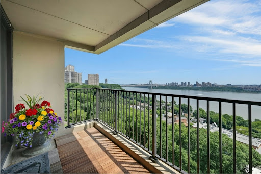 Balcony with river and city view in this luxury apartment / penthouse for sale in Fort Lee ($378,000)