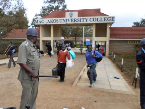 BUNGLED ELECTION: Machakos University College students leave under tight security yesterday. It was closed indefinitely on Monday after two offices and a store were torched. Students were protesting against a flawed elec-