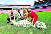 Roy and Annette Nation flank Lindi Gabaza whose son Mduduzi Thomo was one of the 43 victims of the Ellis Park disaster. The Nation family lost their 11-year-old son Rosswin that Wednesday night in April 2001.