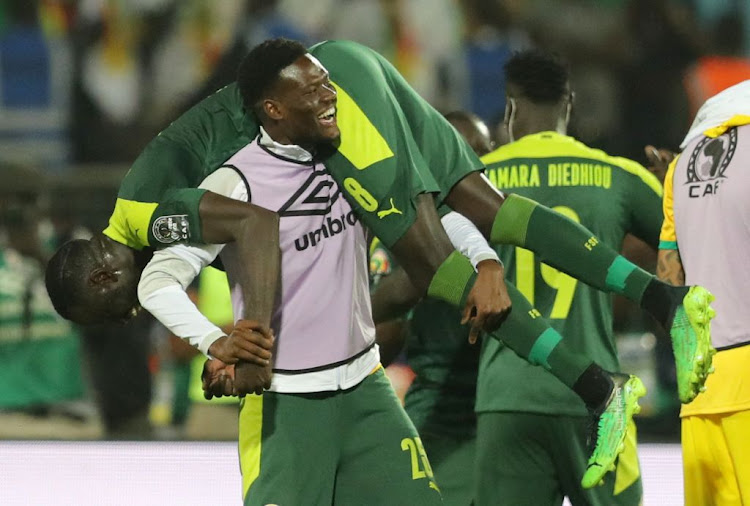 Senegal's Cheikhou Kouyate and Mamadou Loum celebrate after the Africa Cup of Nations quarterfinal match against Equatorial Guinea at Ahmadou Ahidjo Stadium, Yaounde, Cameroon on January 30 2022