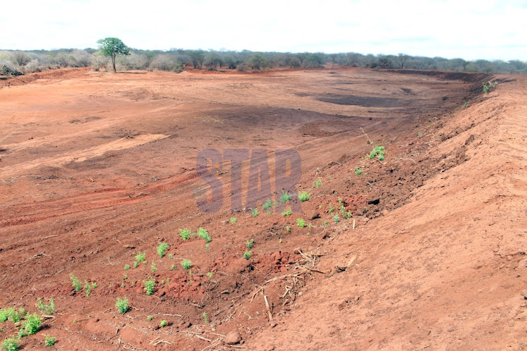 A dried up water pan at Mgeno Conservancy, which serves as an animal corridor joining Tsavo West and East National Parks, Taita Taveta on November 30, 2021. Eight water points have since dried up at the corridor die to ongoing drought/ANDREW KASUKU
