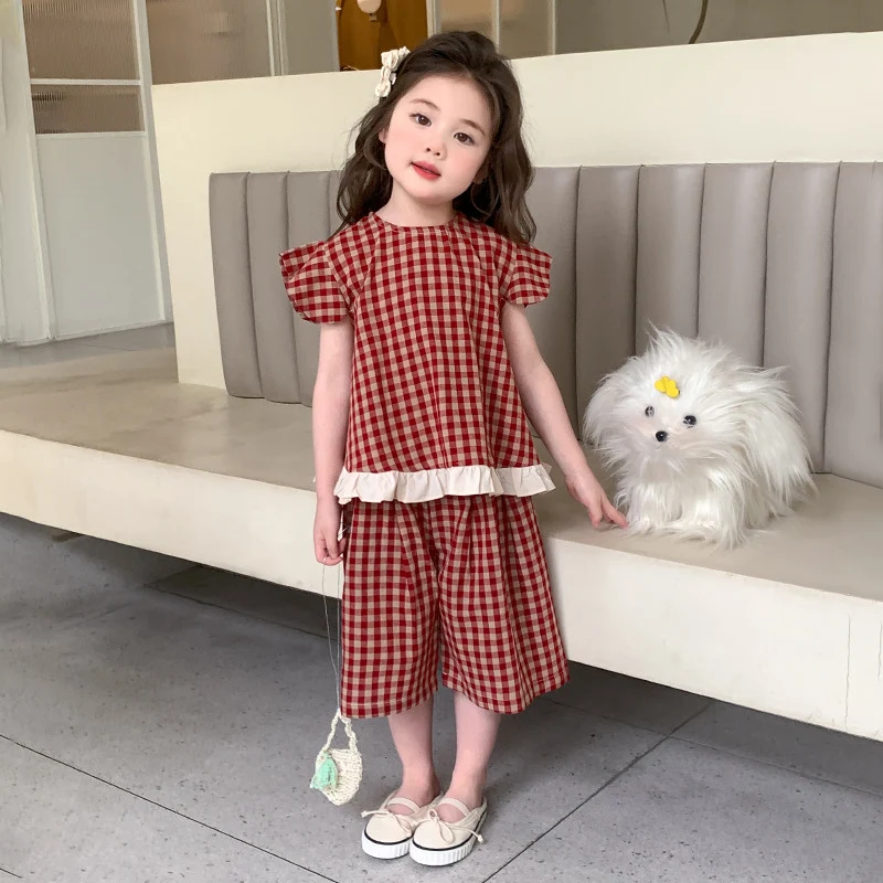 Girls' Summer Plaid Two-piece Set perfect for warm weather fun. Comfortable and stylish, ideal for playing and outings. 