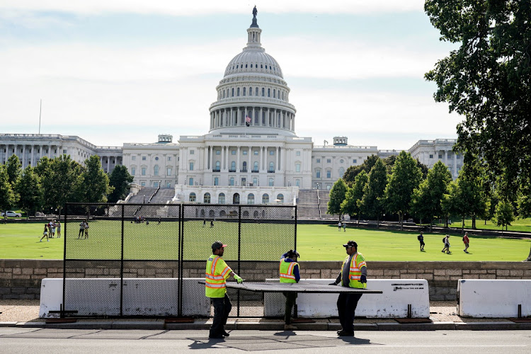 FILE PHOTO: Battling law enforcement outside and inside the Capitol, the rioters were trying to stop Congress from formal certification of Joe Biden's victory in the November 2020 presidential election.