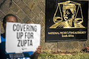 A protester  pickets outside the NPA offices in Pretoria  in 2017. 