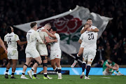 England's Marcus Smith celebrates with George Martin after beating Ireland.  