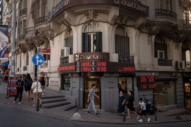 An electronic board displays exchange rate information at a currency exchange bureau in the Sisli district of Istanbul, Turkey. File photo: BLOOMBERG/NICOLE TUNG