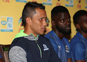 Maritzburg United head coach Fadlu Davids (L) listens to a question during a press conference at Harry Gwala Stadium on September 07, 2017 in Durban, South Africa. 