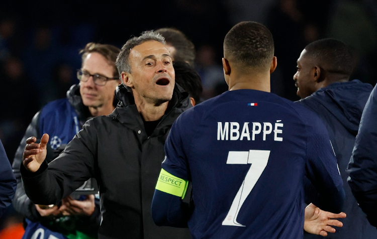 Paris St-Germain's Kylian Mbappé celebrates with coach Luis Enrique after their Uefa Champions League last 16 second leg win against Real Sociedad at Reale Arena in San Sebastian, Spain on Tuesday night.
