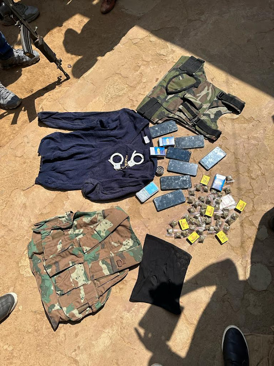 Military and police gear was among the items seized during the arrests.