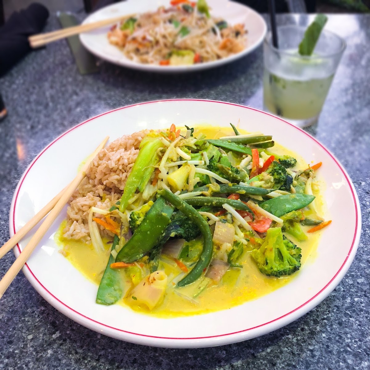 Yellow curry vegetable stir fry! Red rimmed plate = allergy meal.