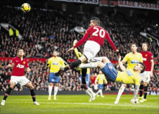 MARKED MAN: Manchester United's Robin van Persie is challenged by Newcastle United's Mathieu Debuchy during their English Premier League game at Old Trafford on Saturday PHOTO:REUTERS