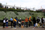 Black Friday shoppers queue at Woodmead Value Mart in Johannesburg on November 26 2021.