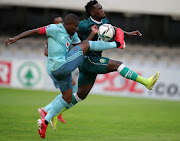 Sphelele Mthembu of AmaZulu tackled by Ntsikelelo Nyauza of Orlando Pirates during the DStv Premiership 2021/22 match between AmaZulu and Orlando Pirates at Jonsson Kings Park Stadium, Durban.