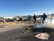 Protesters blocked the N7 in Cape Town with burning debris. 