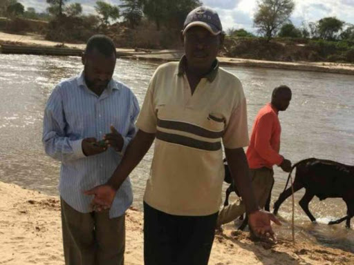 Relatives of the 15-year-old boy who was killed by a crocodile at the scene of the attack in Kibwezi Sub-county, July 8, 2018. /MUTUA KAMETI