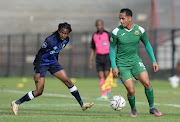 Sirgio Kammies of Cape Town All Stars is challenged by Kamohelo Mahlatsi of Swallows during their promotion playoffs match at Danie Craven Stadium in Stellenbosch on 11 May 2022