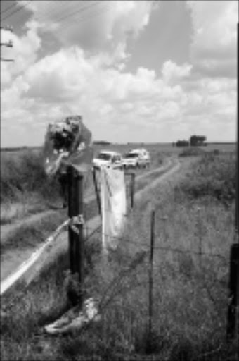 CRIME SCENE: Flowers mark Eugène 'ET' Terre'Blanche's farm where he was killed on Saturday. Pic: BONGANI MNGUNI. 05/04/2010. © Sowetan. Outside Eugene "ET" Terreblanche's farm where he was killed :PHOTO:BONGANI MNGUNI