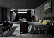 The master bedroom and dressing room emphasizes horizontal space in contrast to the vertical space of the living room. 