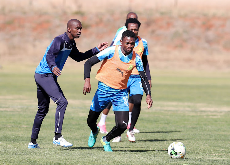 Mamelodi Sundowns were still mourning the death of Anele Ngcongca (L), who was Motjeka Madisha's teammate at Mamelodi Sundowns as seen in this photograph of them during the 2017 Caf Champions League training in Chloorkop.