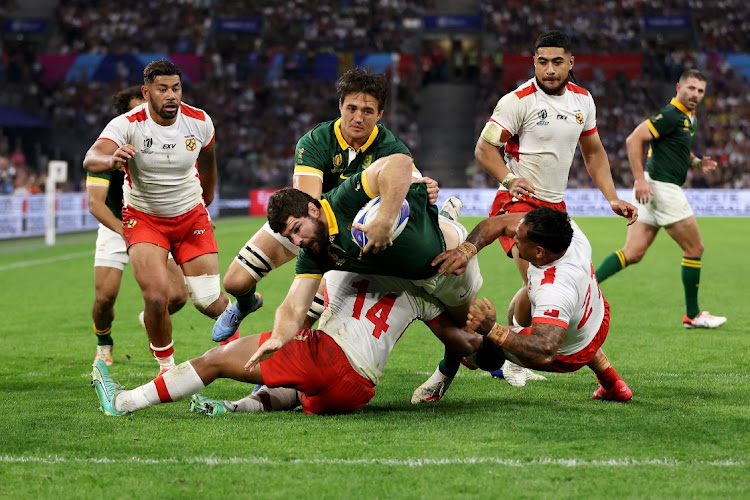 Marco van Staden breaks through the tackles of Fine Inisi and Sonatane Takulua of Tonga to score the Springboks's sixth try in the Rugby World Cup pool B match at Stade Velodrome in Marseille on Sunday night.