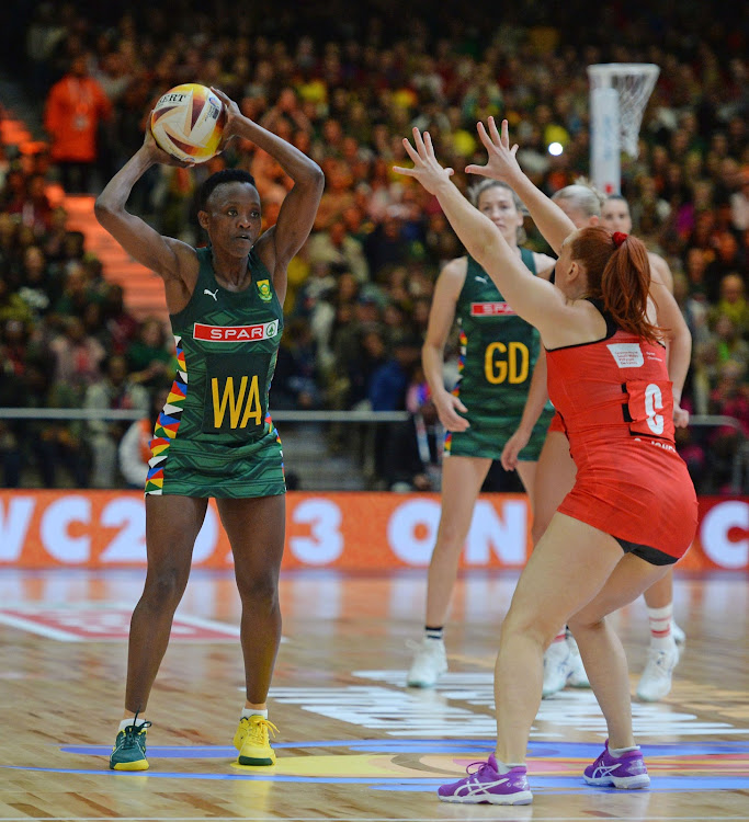 South Africa captain Bongi Msomi is challenged by Clare Jones of Wales during their 2023 Netball World Cup game at CTICC in Cape Town, South Africa on 28 July 2023.