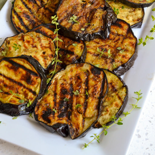 This delicious and easy Grilled Eggplant recipe is brushed with olive oil and seasoned with marjoram and thyme.  Enjoy some today and reap the health benefits of fresh eggplant.