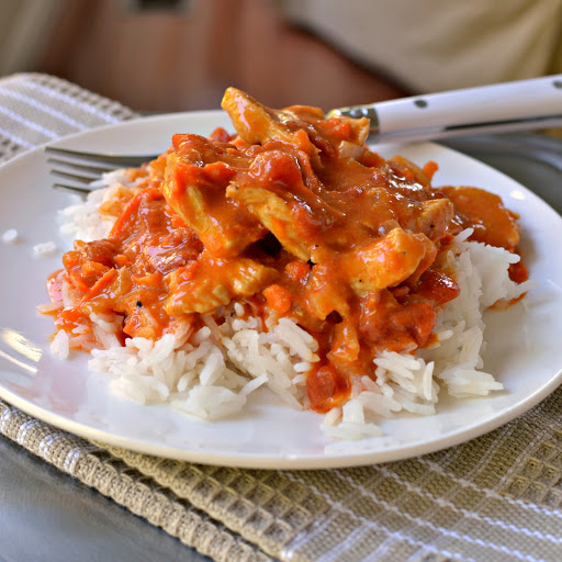 This Chicken Curry with Coconut Milk combines red curry, onions, carrots, and stewed tomatoes in a creamy coconut milk base.