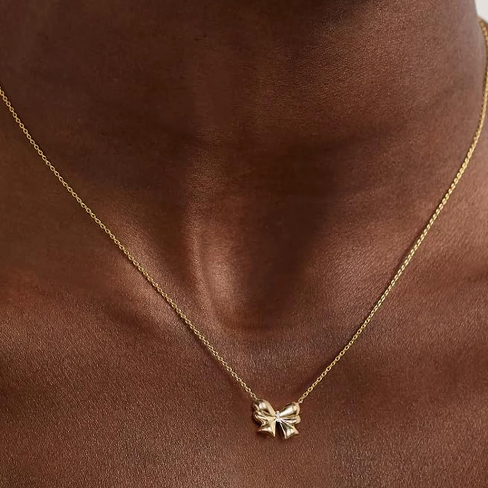 Collier nœud pour femme, chaîne de clavicule dorée, tendance et polyvalent, un accessoire de mode incontournable pour sublimer votre style et votre personnalité.