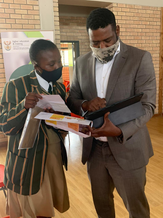 Higher Education Science and innovation deputy minister Buti Manamela with a Pupil at Nelson mandela school science and technology in Mvezo.