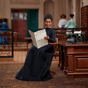 A Barbie doll portraying pioneering civil rights activist and suffragist Ida B. Wells, holding a 