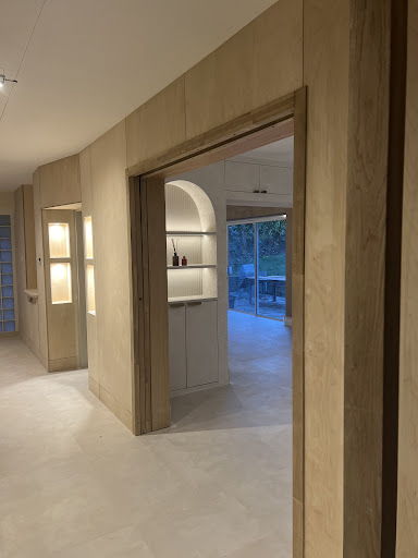 Double doors opened with stay open mechanism and touch close.