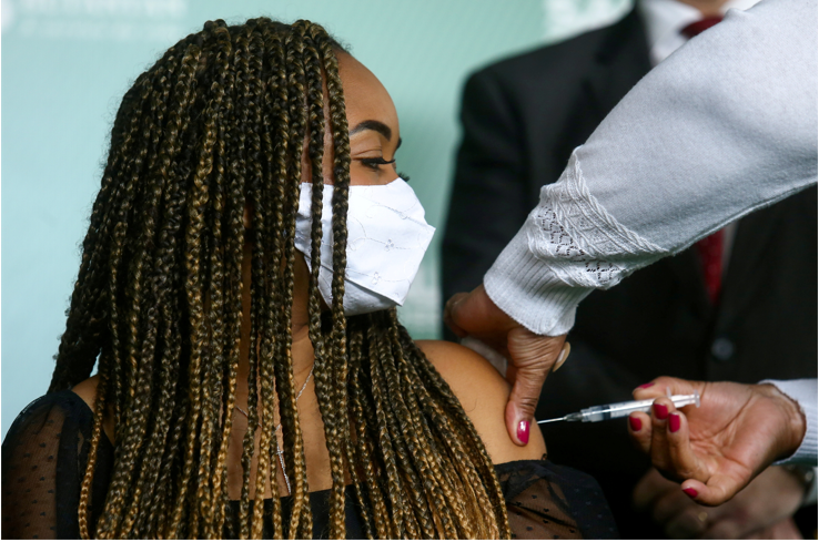 Gabrielly Esperanca dos Santos receives a dose of Sinovac’s CoronaVac vaccine in Sao Paulo, Brazil on August 16 2021. Researchers believe those who've had the CoronaVac vaccines may need two boosters to protect against Omicron.