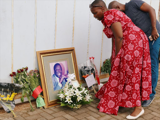 Mourners place flowers as they pay respects to Movement For Democratic Change (MDC) leader Morgan Tsvangirai at his residence in Harare, Zimbabwe February 17, 2018. /REUTERS