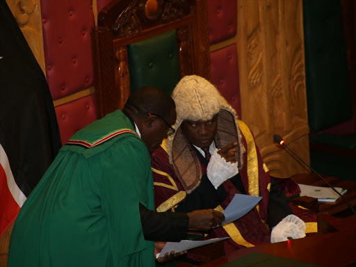 National Assembly speaker Justin Muturi (R) confers with an official during a session on August 21, 2017. /HEZRON NJOROGE