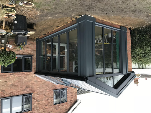 Anthracite grey conservatory with gable end and slate finish ultra 380 roof