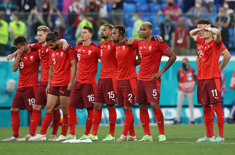 Switzerland players look on from the halfway line during the penalty shootout the Uefa Euro 2020 Championship quarterfinal against Spain at Saint Petersburg Stadium in Saint Petersburg, Russia on July 02, 2021.