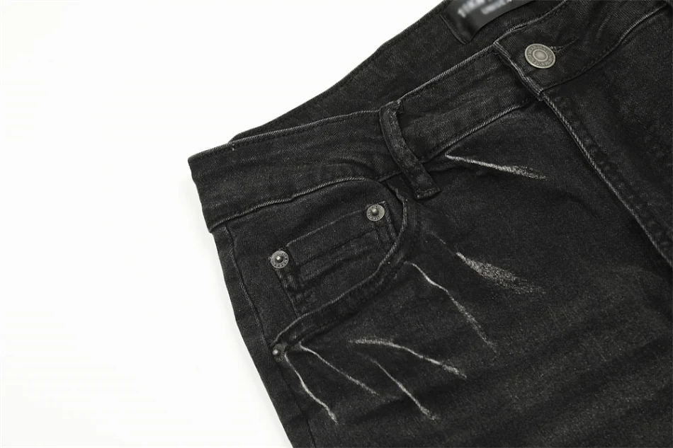 Pantalon en jean lâche troué inkjet pour homme, confortable et tendance, idéal pour un look décontracté et stylé. Profitez du confort.